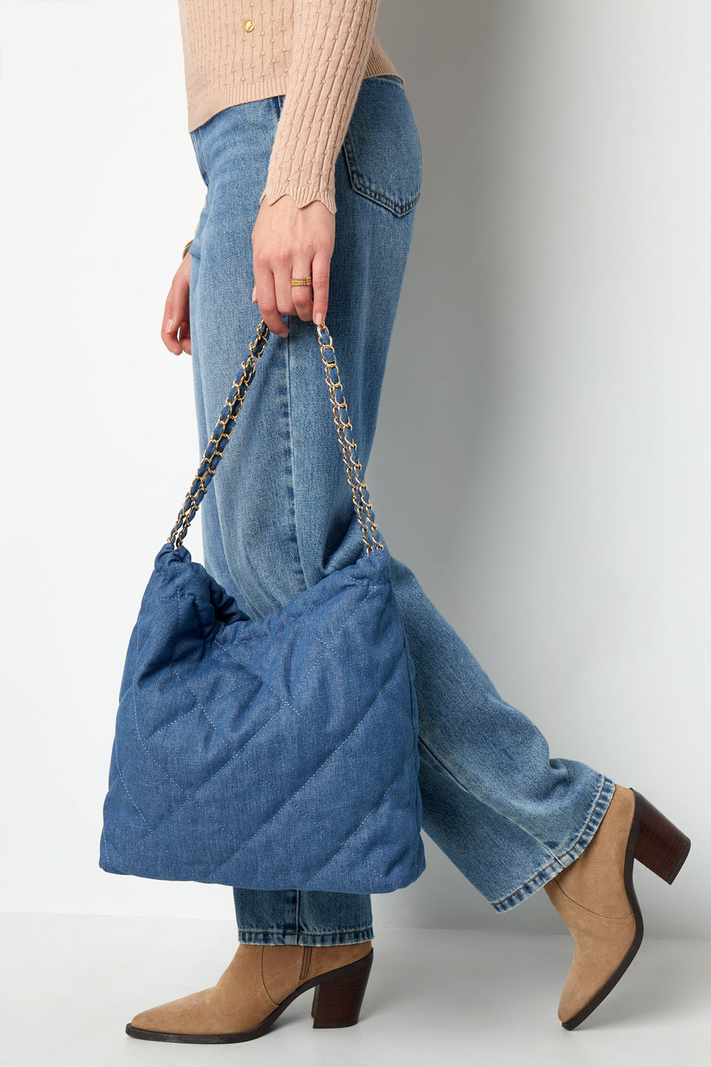 Denim bag with stitched motif and chain