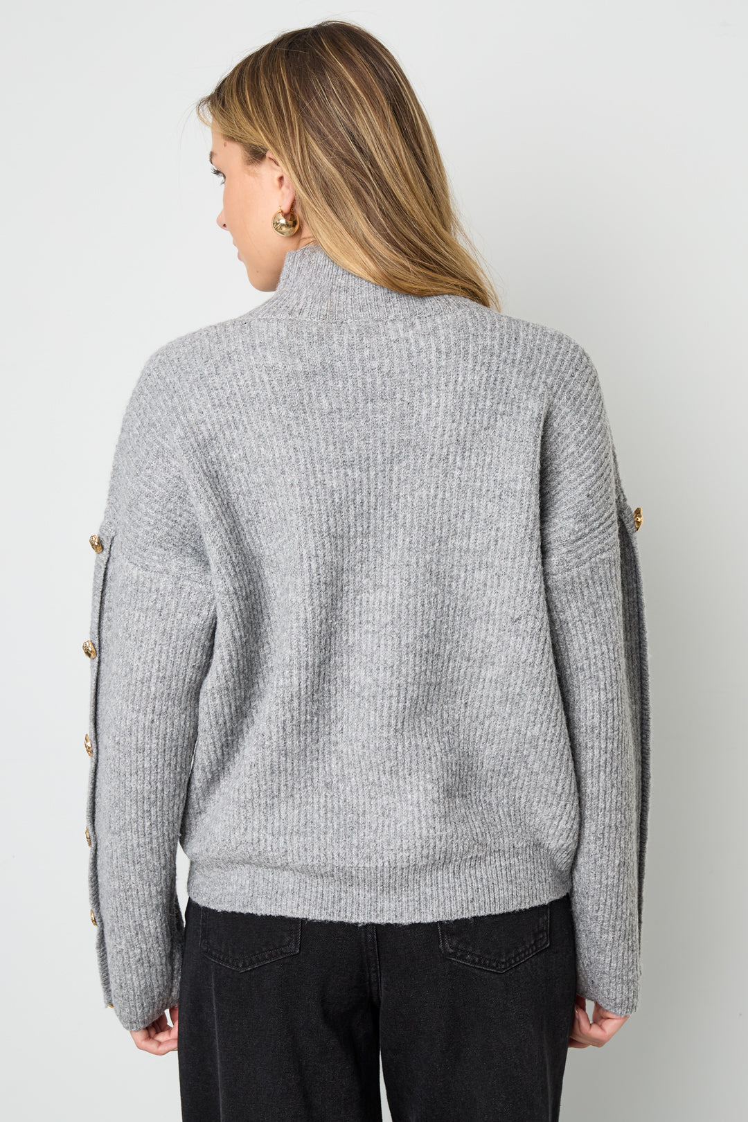 Sweater with buttons on the sleeves
