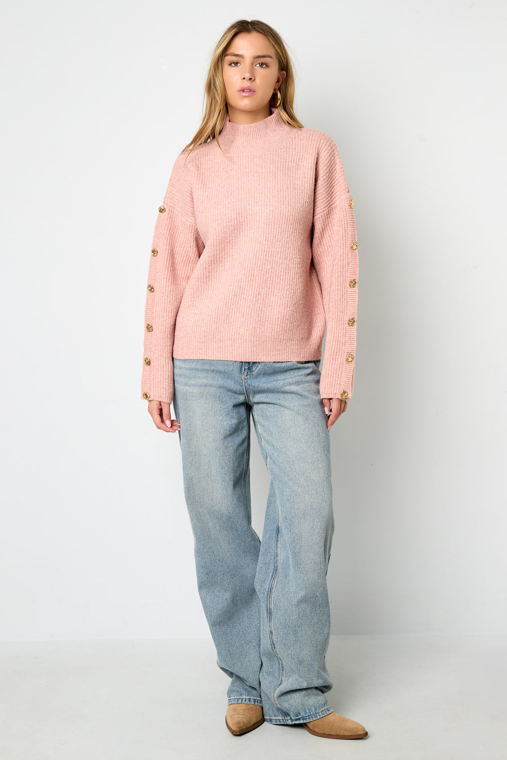 Sweater with buttons on the sleeves